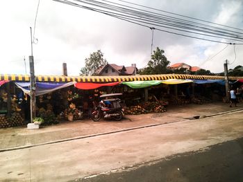 Cars on road against sky