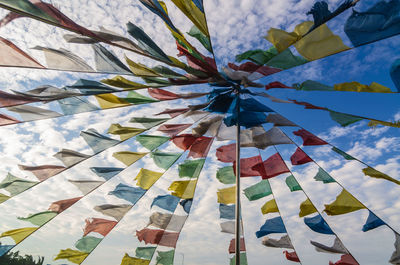 Low angle view of colorful tibetan flags