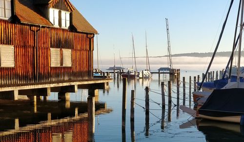 Boats moored in harbor