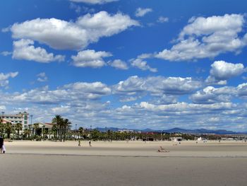 View of beach against cloudy sky