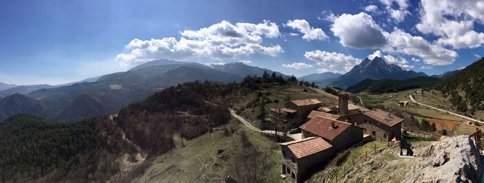 Panoramic view of landscape against cloudy sky