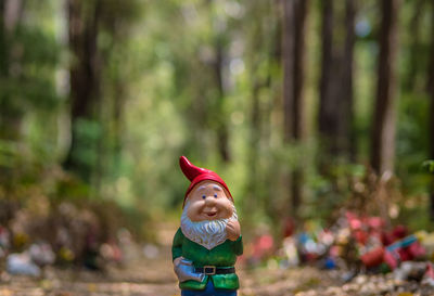 Close-up of boy against trees