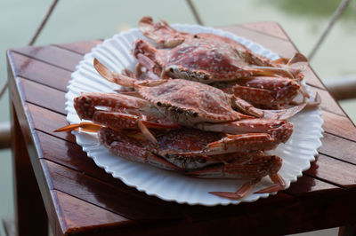 High angle view of crabs in plate on table