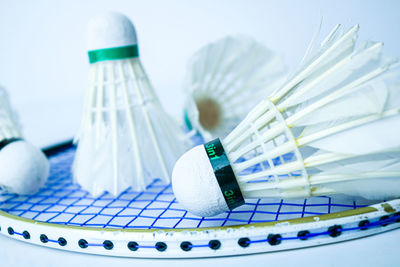 Close-up of shuttlecocks and sport racket 