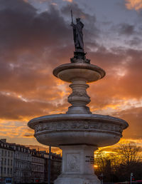 Low angle view of statue at sunset