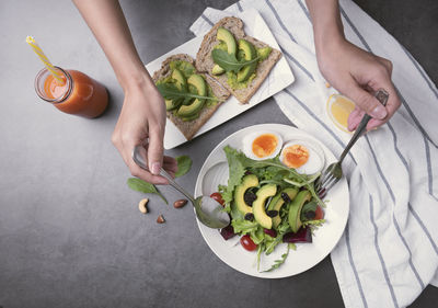 High angle view of person preparing food on table