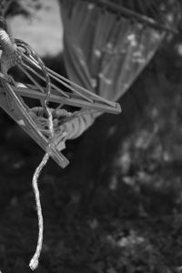 Close-up of rope tied up on metal field