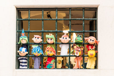 Multi colored toy toys against wall