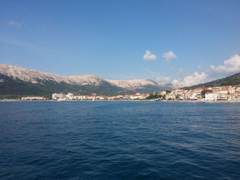 Scenic view of mountains against blue sky