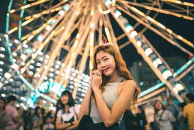 Portrait of woman standing at night