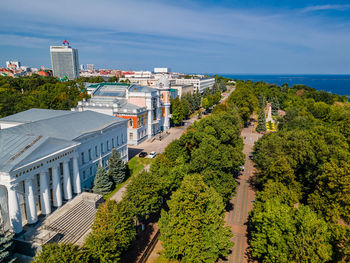 High angle view of trees and buildings against sky