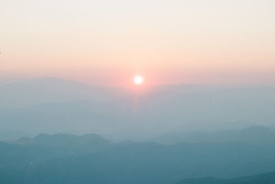 Scenic view of mountains against sky during sunset