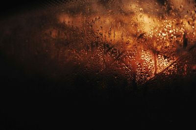 Close-up of raindrops on glass window