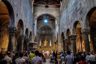 Group of people in cathedral during ceremony