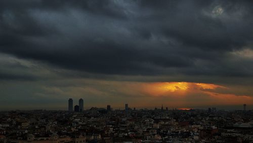 Cityscape against sky during sunset