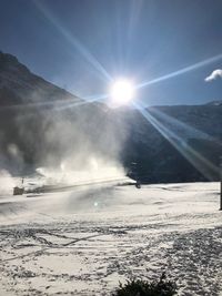 Sun shining over frozen mountain