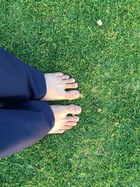 Low section of woman on grass