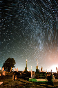 Buildings against sky at night