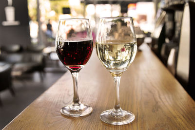 Close-up of wine glasses on table