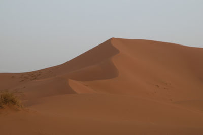 Scenic view of desert against clear sky