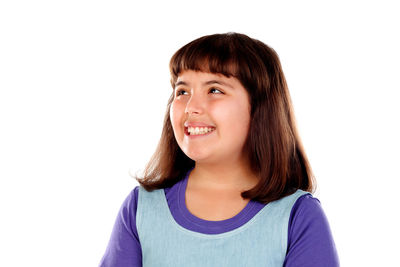 Portrait of smiling young woman against white background