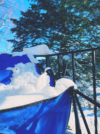 Scenic view of snow covered land against blue sky
