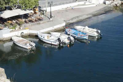 High angle view of boats moored at harbor