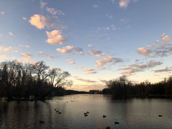 Scenic view of lake against sky during sunset