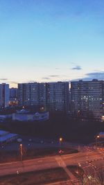 Cityscape against clear blue sky