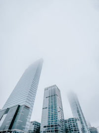 Low angle view of modern buildings against clear sky