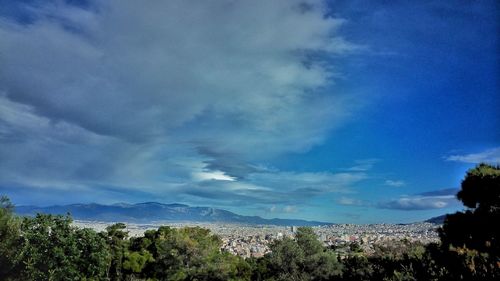 Scenic view of landscape against cloudy sky