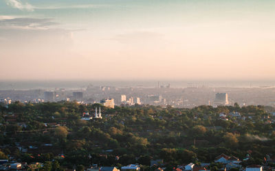 High angle view of buildings in city against sky