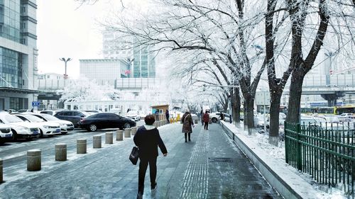 People walking on footpath in winter