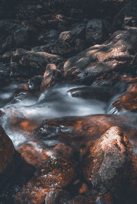 Close-up of water flowing through rocks