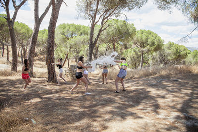 San martin de valdeiglesias, madrid, spain. group of women playing with water to cool off in summer.