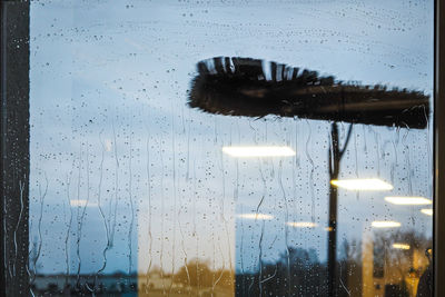 Close-up of wet glass window in rainy season