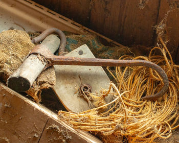 High angle view of rusty metal on wood