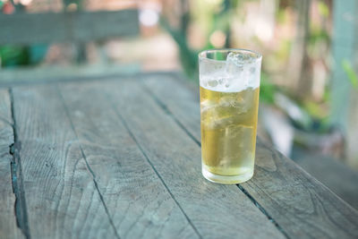Close-up of beer glass on table