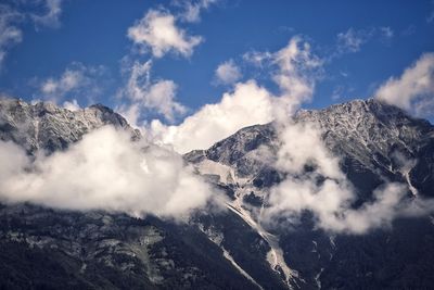 Low angle view of mountain range against sky