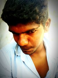 Close-up portrait of a serious young man