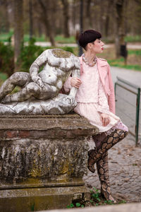 Woman looking at sculpture