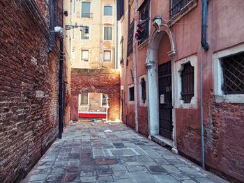 Narrow pathway along built structures