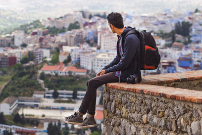 Tourist looking at city view