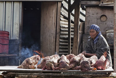 Portrait of man feeding horse