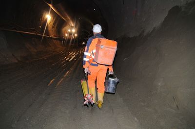 Rear view of man working at night