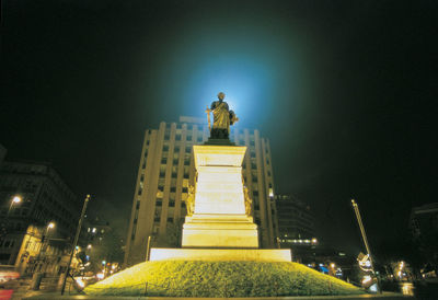 Low angle view of statue at night