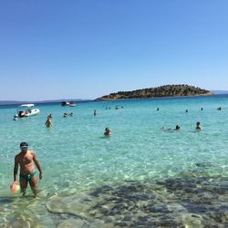 Scenic view of sea against blue sky