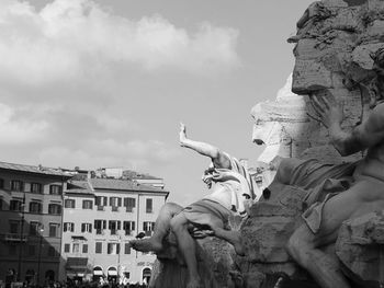 Low angle view of statue against cloudy sky