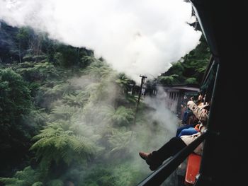 Panoramic shot of people seen through car window