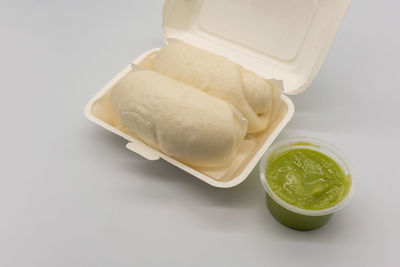 High angle view of dessert on white table